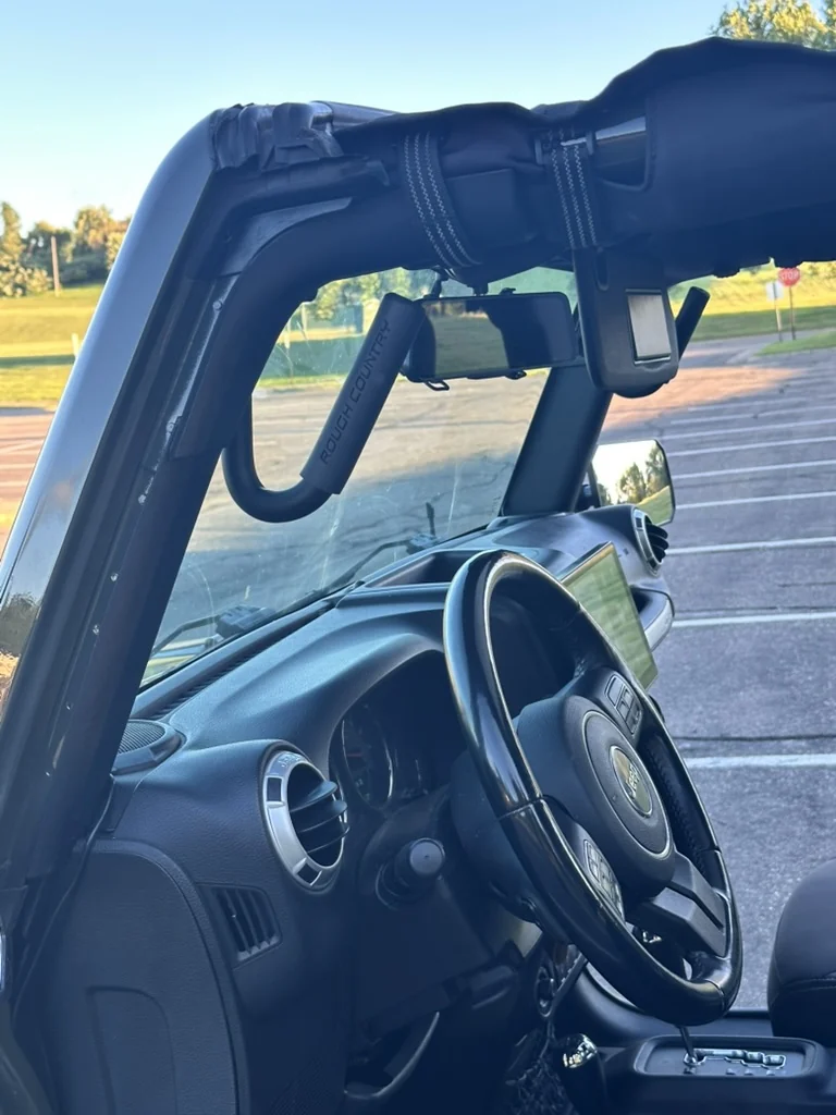 Rough Country grab handle installed on the green 2015 four-door JKU